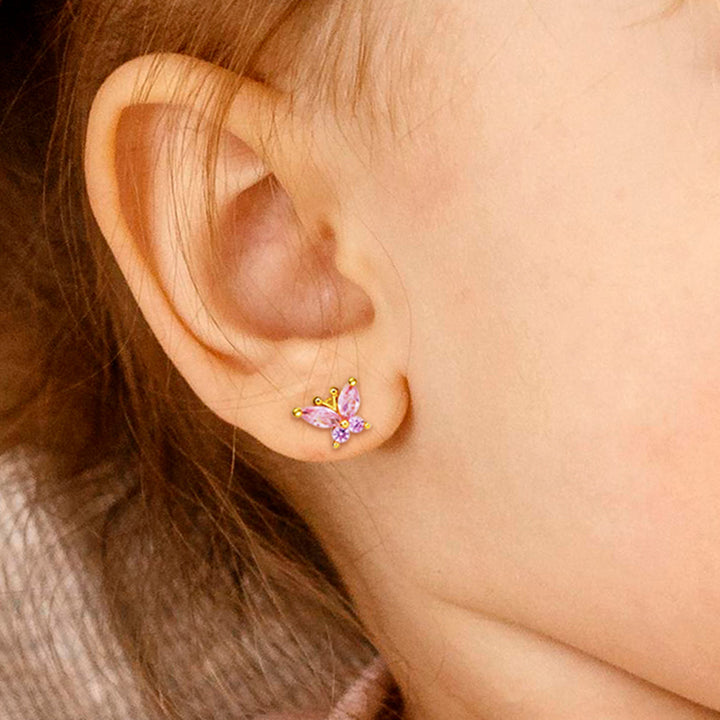 Baby Girl Wearing Crystal Butterfly Earrings